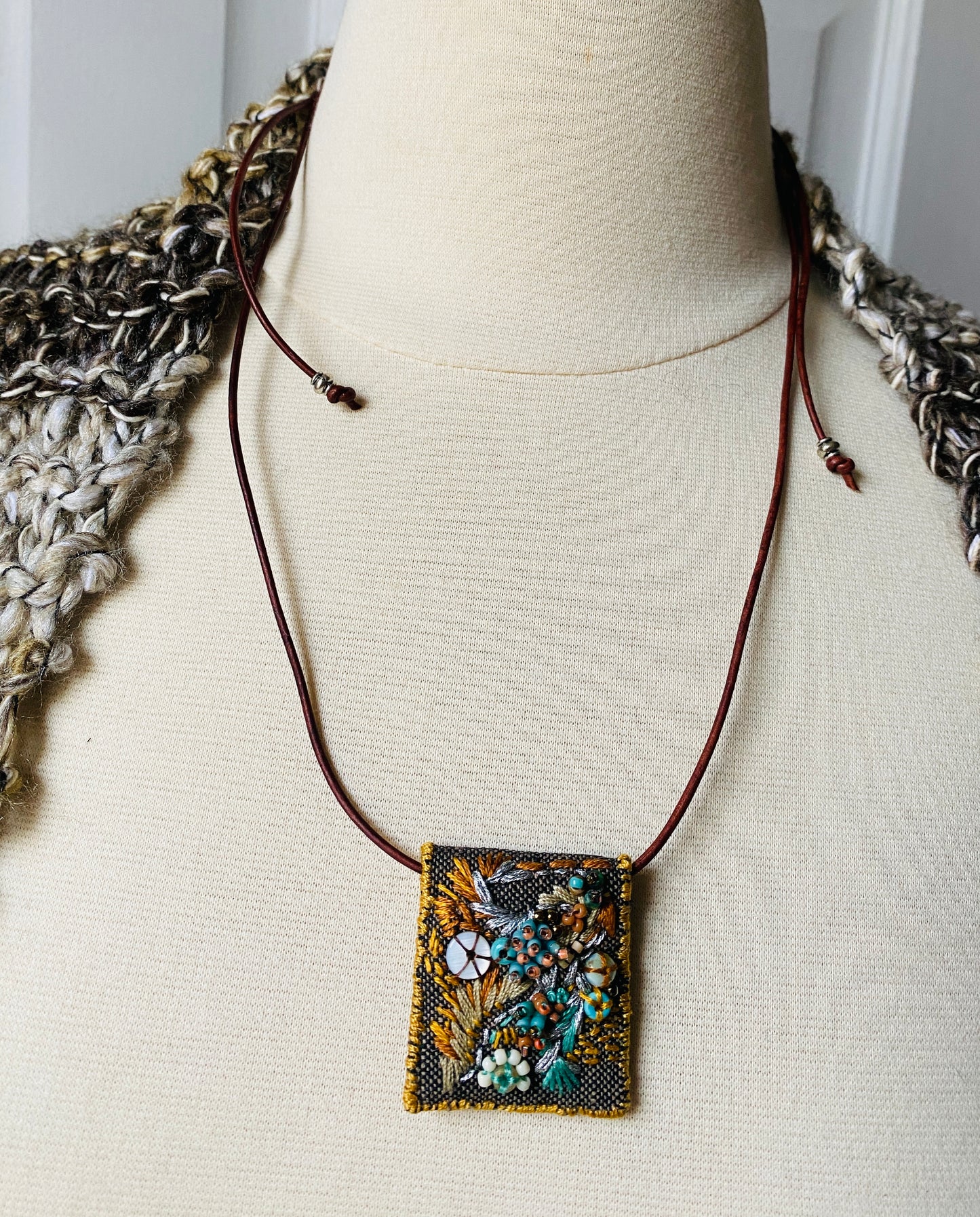 "Flying dove" Aqua, gold, tan embroidered, beaded textile necklace.