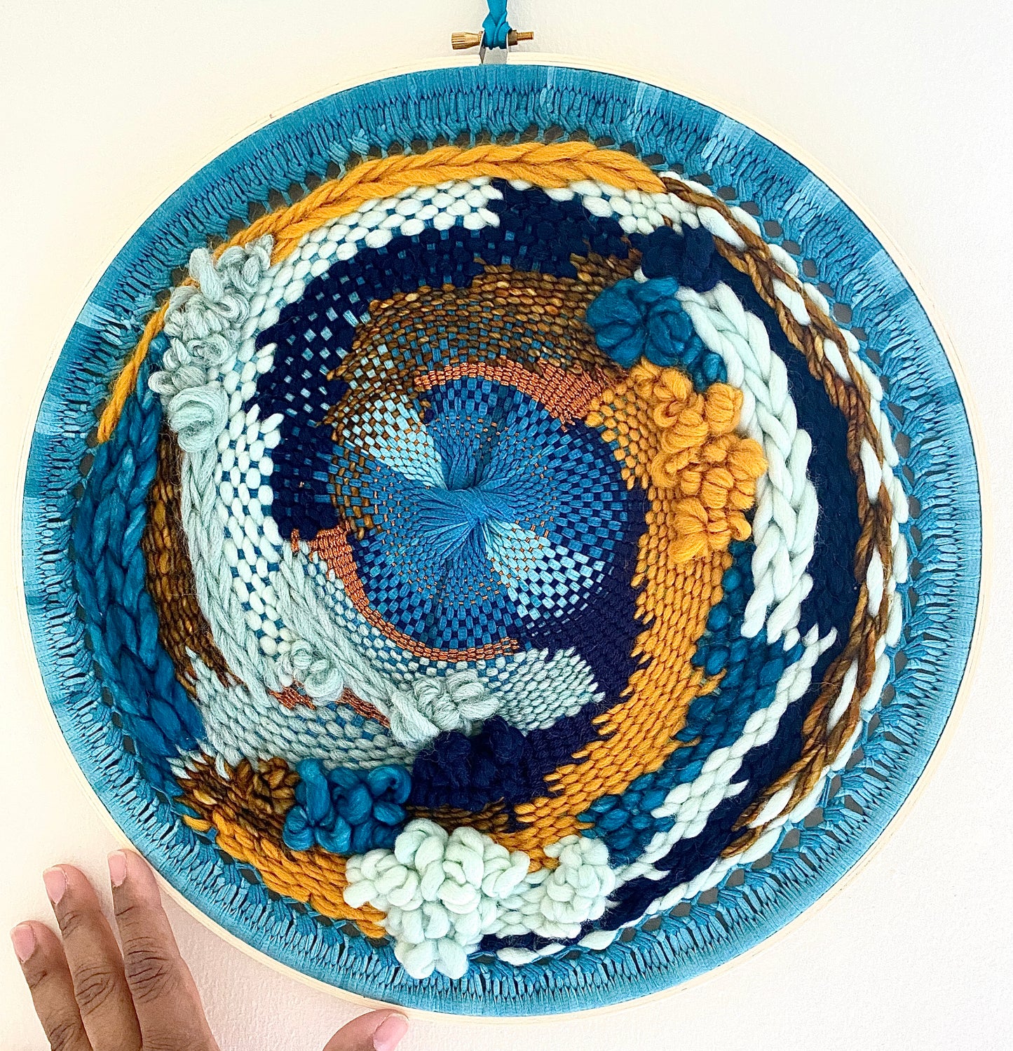 "Whirlpool" round woven wall hanging