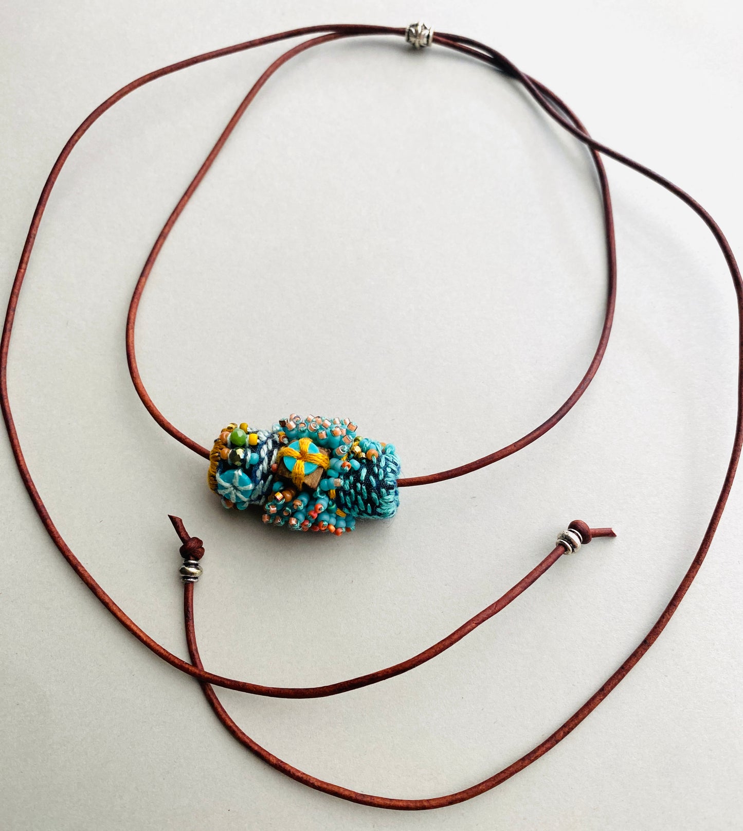 "Andromeda" turquoise embroidered and beaded textile necklace.