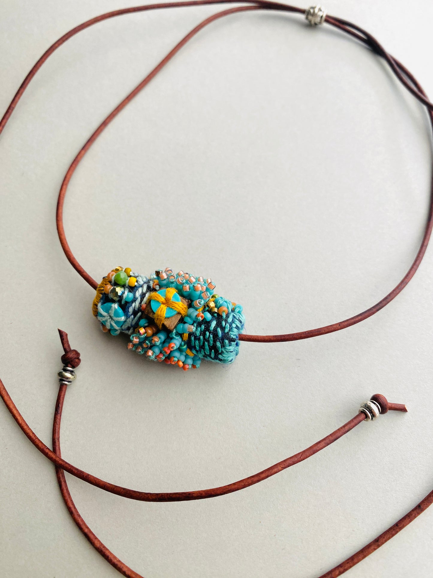 "Andromeda" turquoise embroidered and beaded textile necklace.