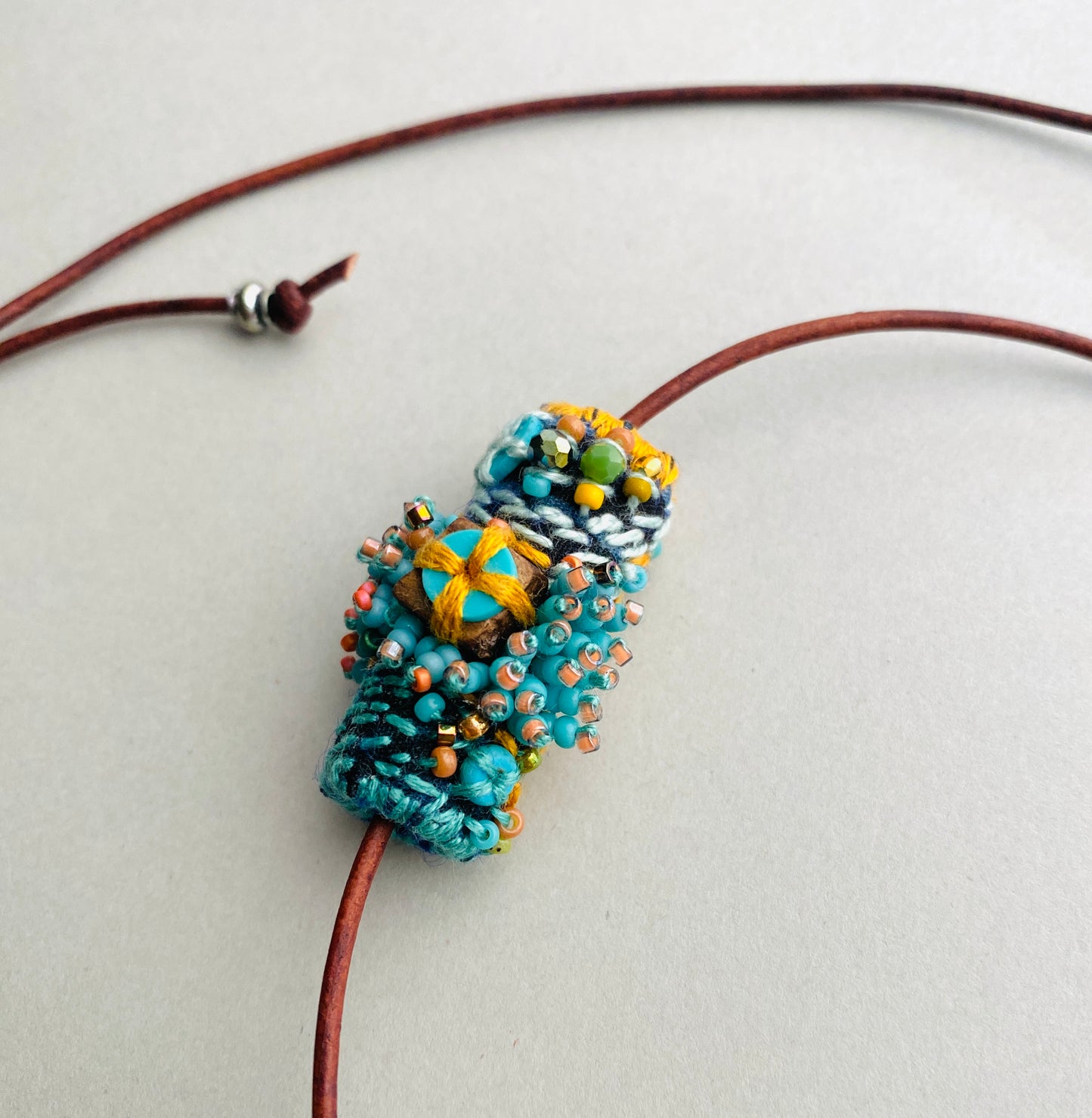 "Andromeda" turquoise embroidered and beaded textile necklace.