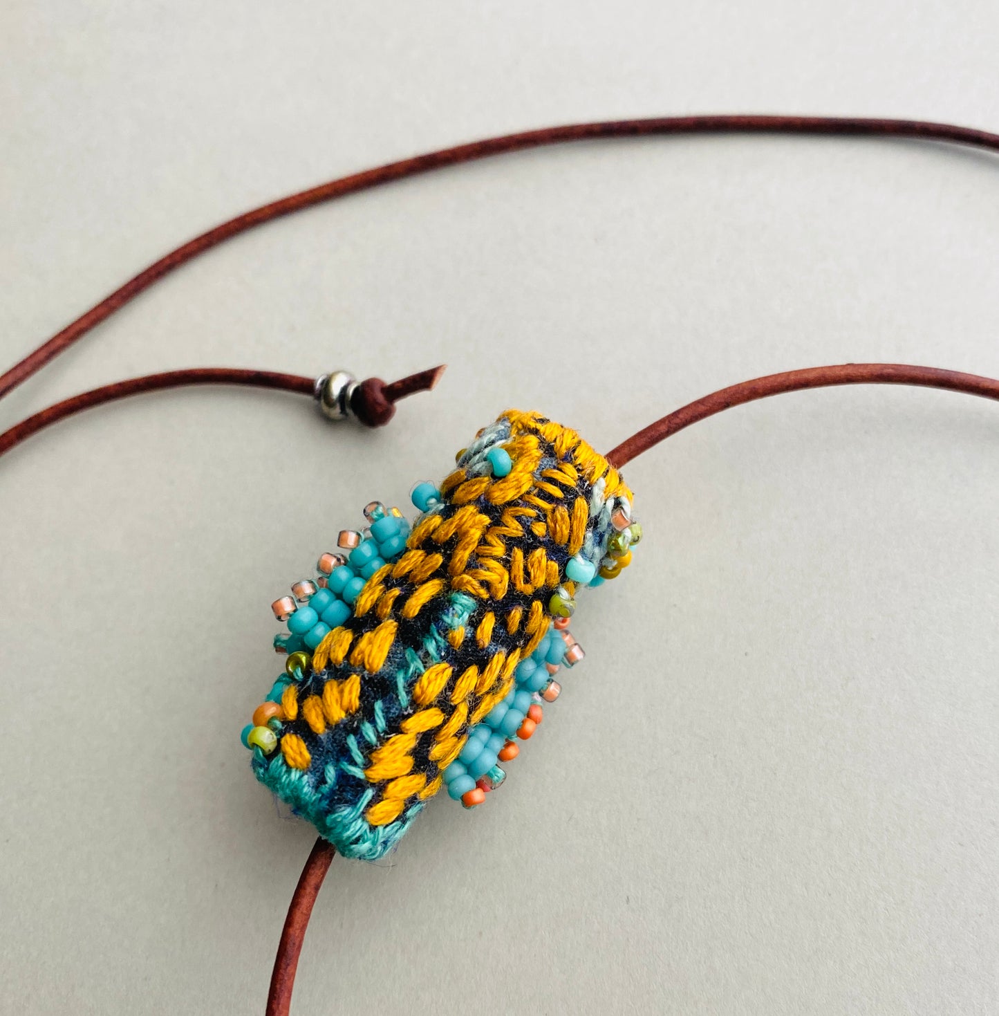 "Andromeda" turquoise embroidered and beaded textile necklace.