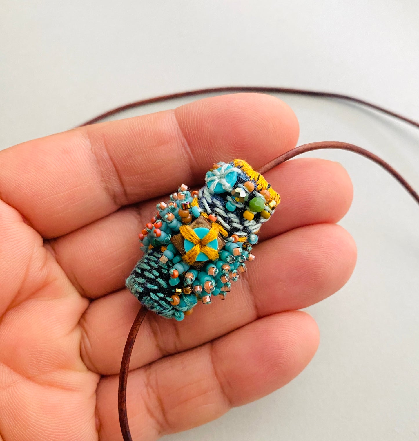 "Andromeda" turquoise embroidered and beaded textile necklace.