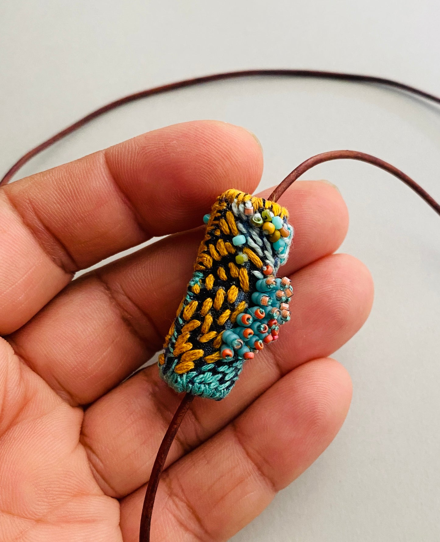 "Andromeda" turquoise embroidered and beaded textile necklace.