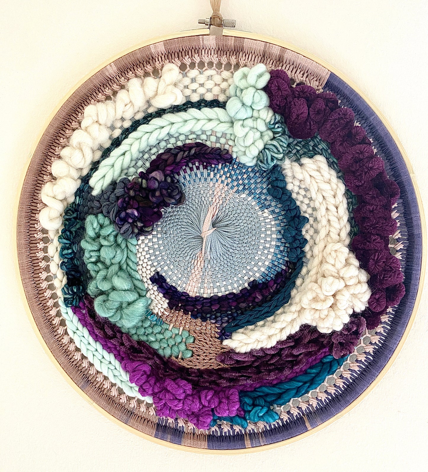 Plum clouds round woven wall hanging