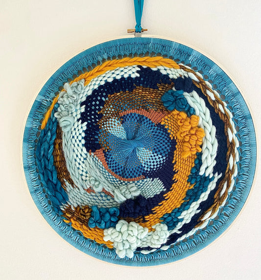 "Whirlpool" round woven wall hanging