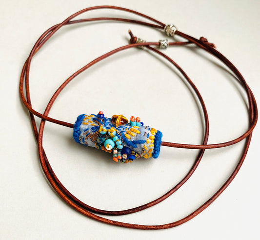 "Oceana" Blue, aqua and orange embroidered and beaded textile necklace.