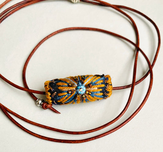 "Night star" textile necklace in copper and blue