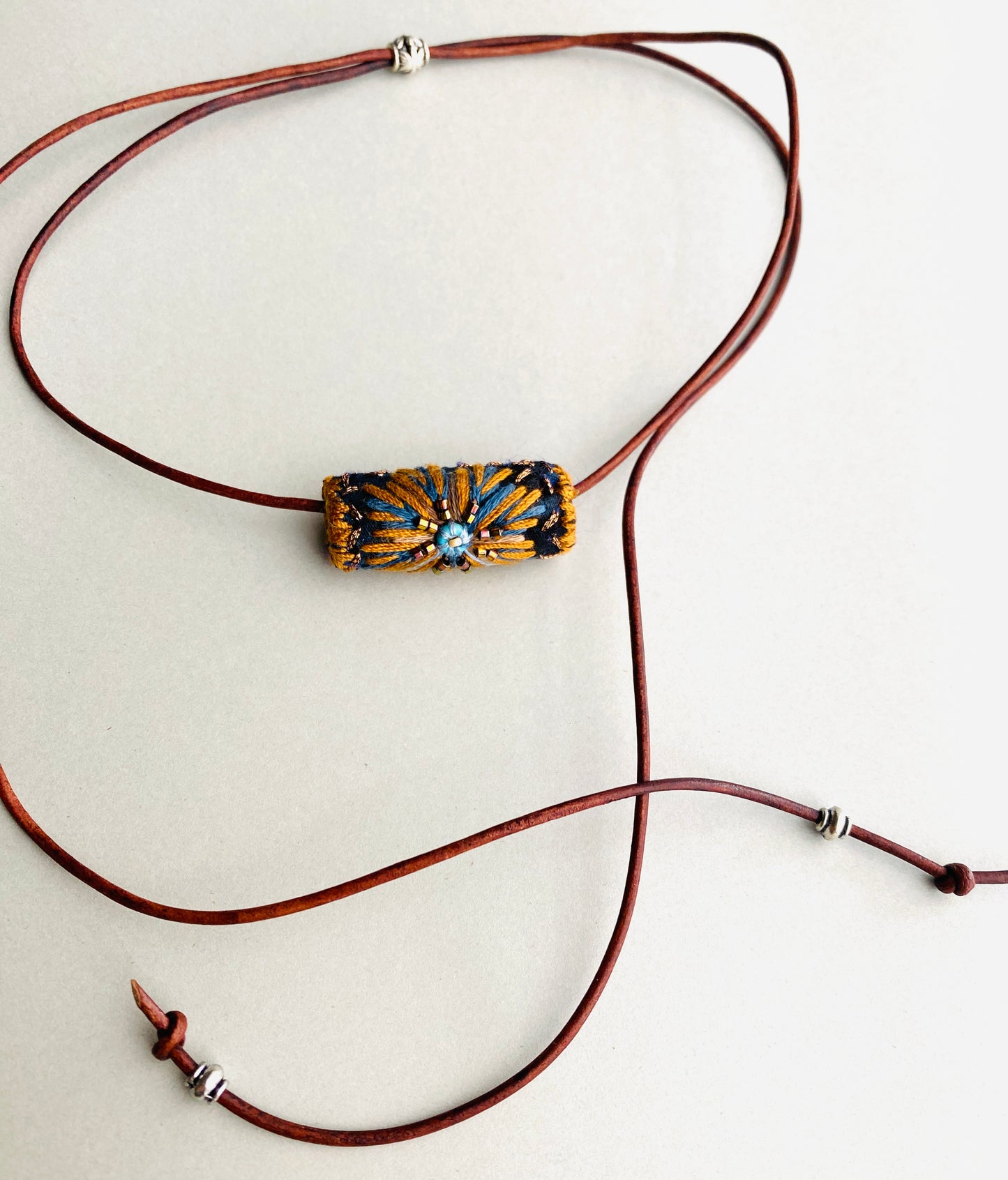 "Night star" textile necklace in copper and blue
