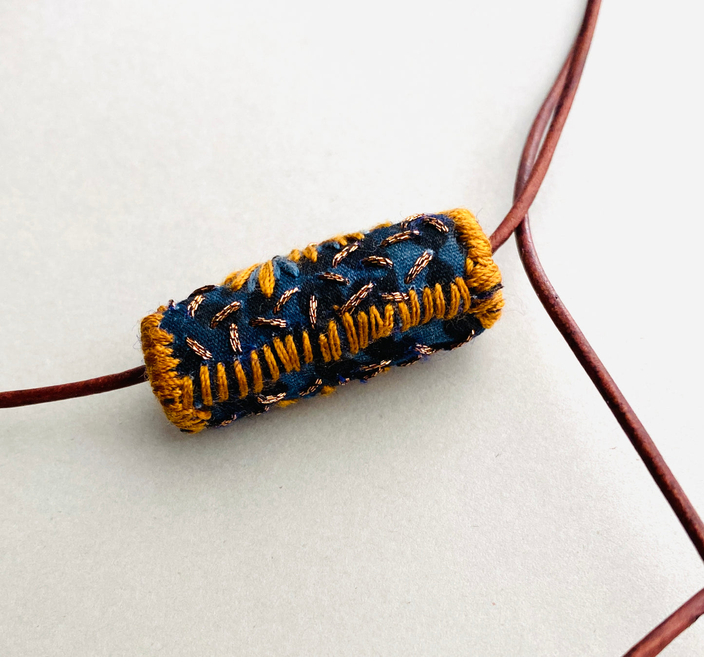 "Night star" textile necklace in copper and blue