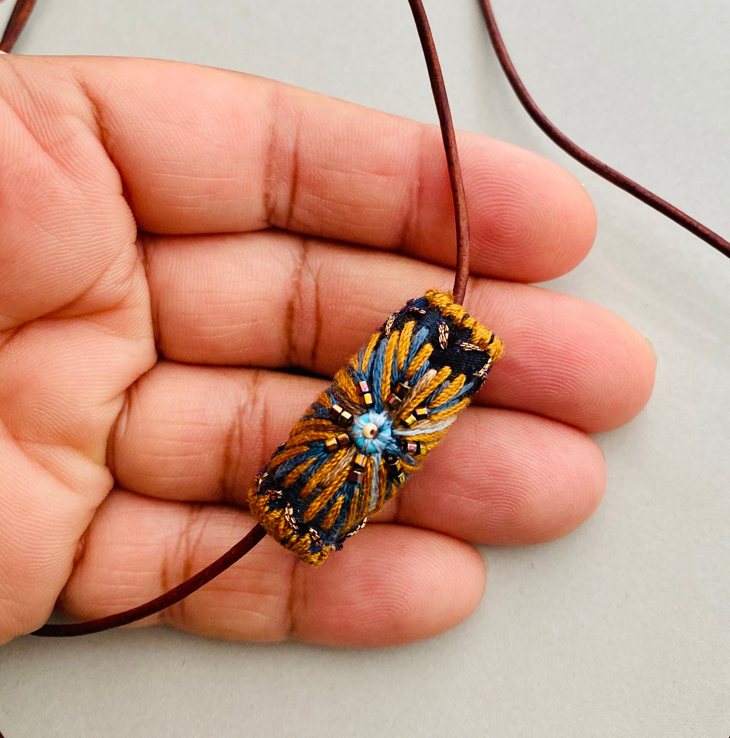 "Night star" textile necklace in copper and blue