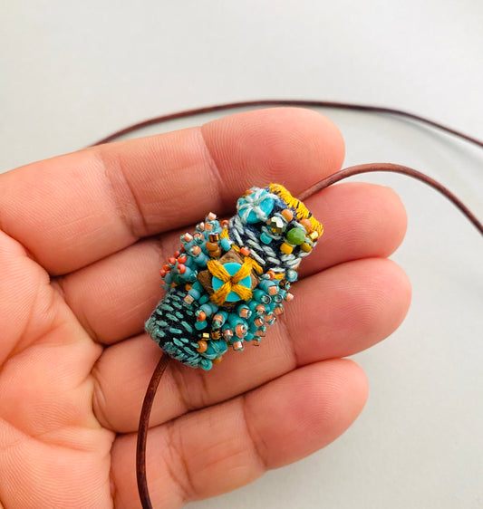 "Andromeda" turquoise embroidered and beaded textile necklace.